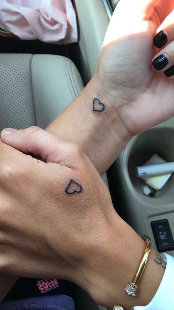 Matching heart tattoos for couples